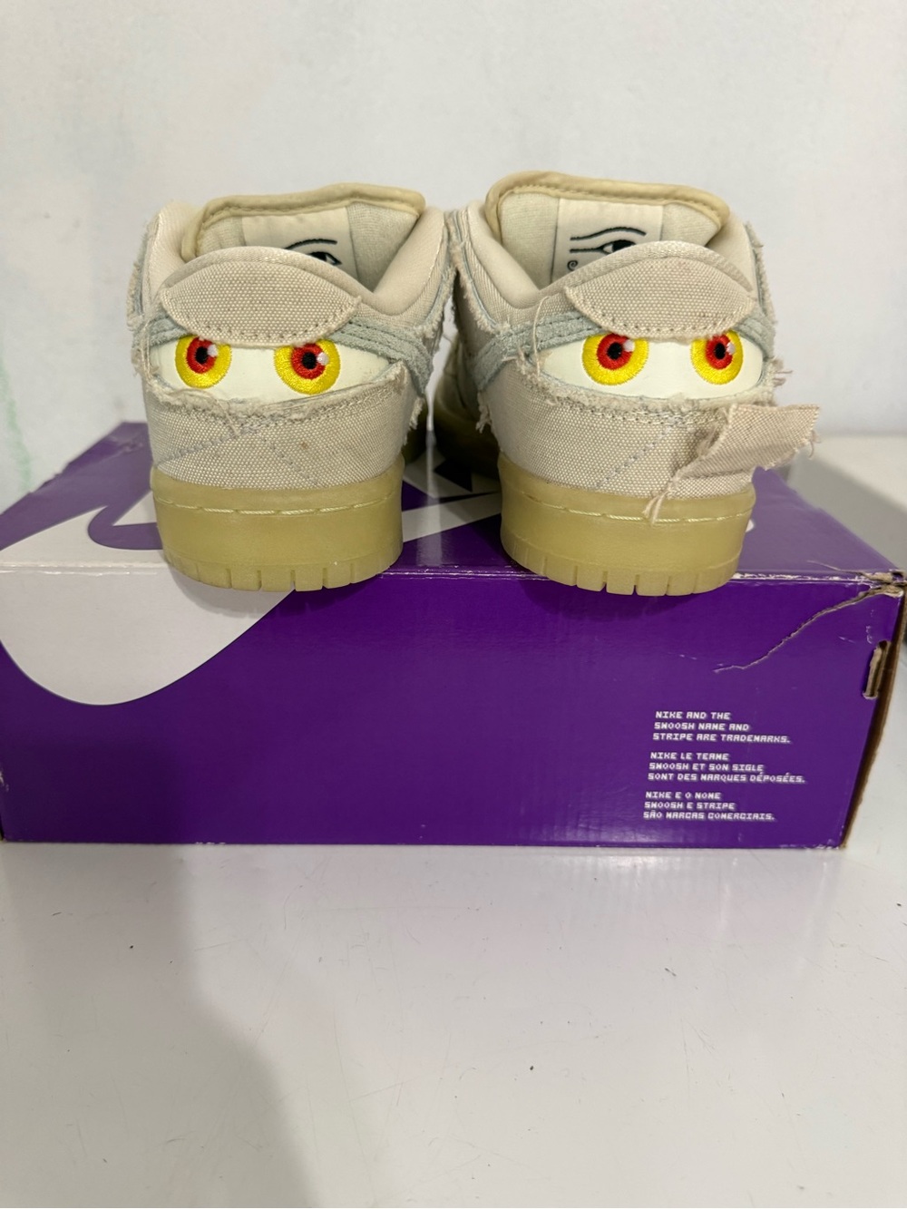 Nike Kids Beige Sneakers with Yellow & Red Eye Detail
